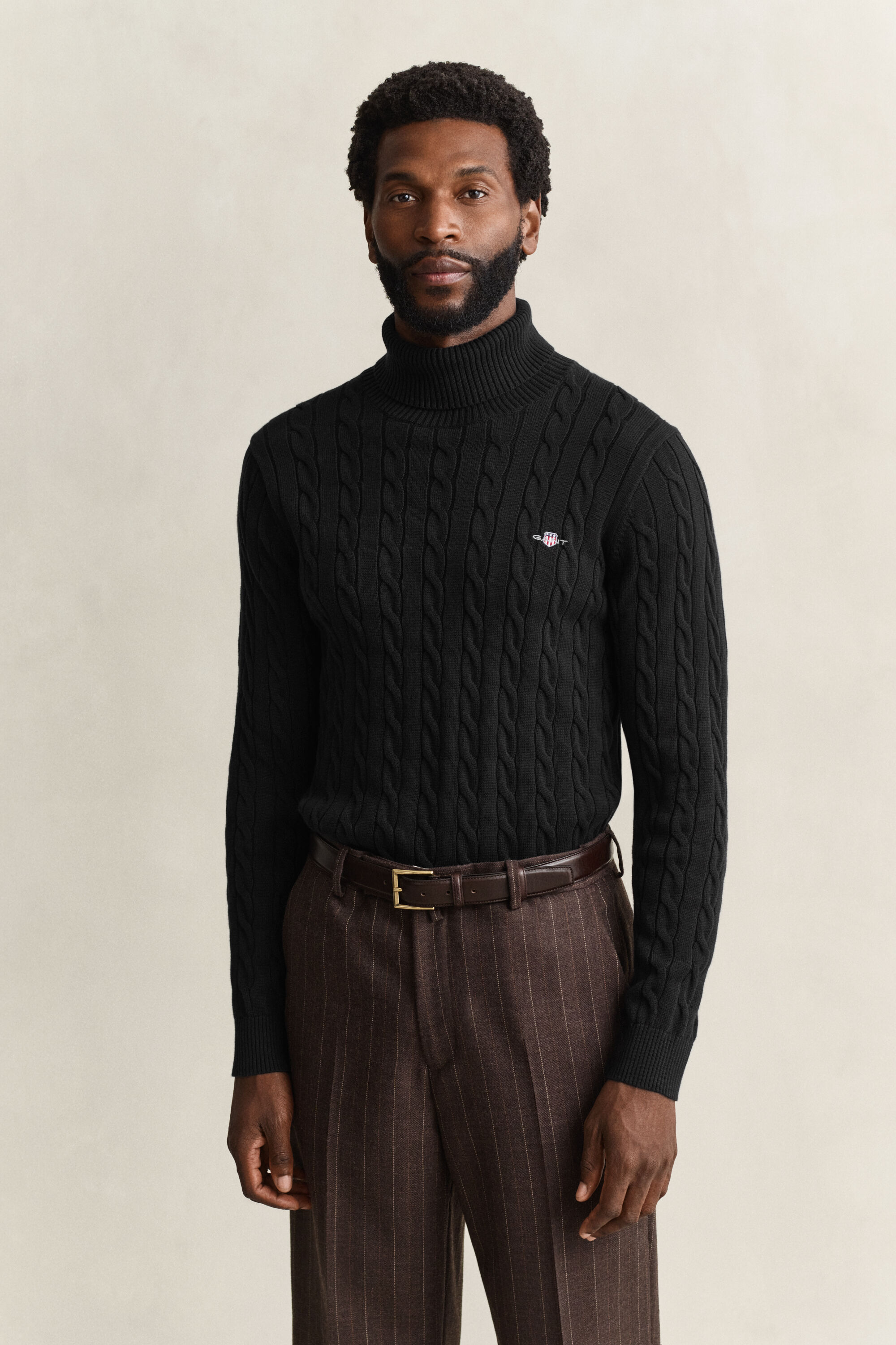 Maglia a collo alto in cotone a trecce