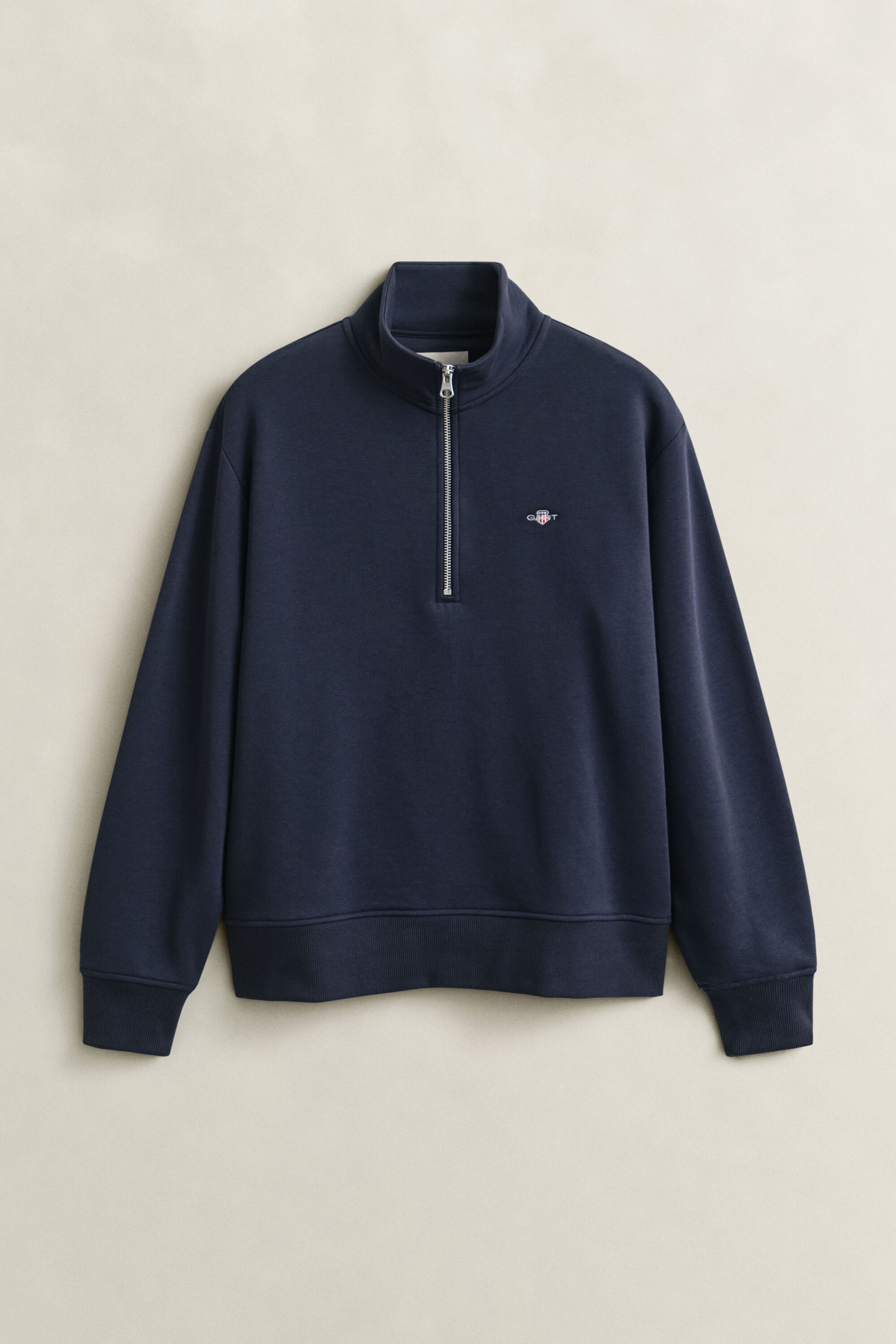 Felpa Shield con zip corta