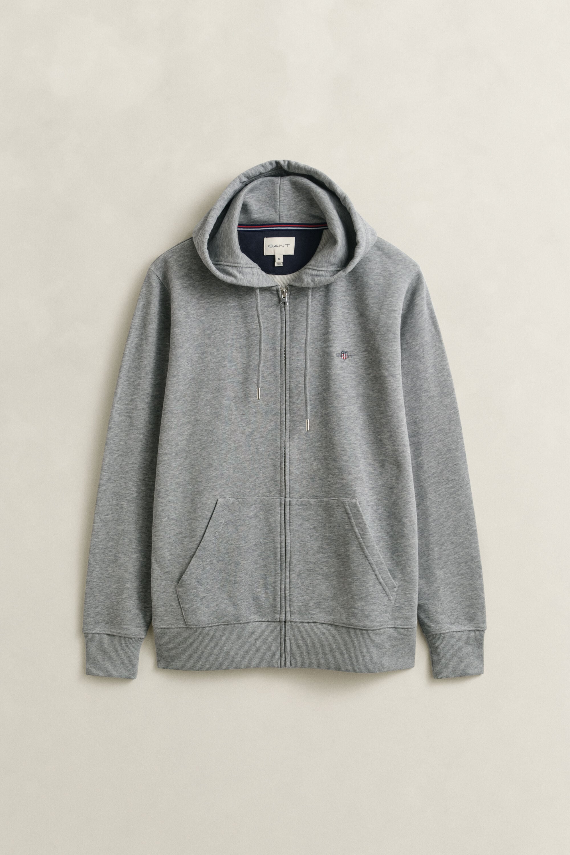 Sweat à capuche zippé avec écusson
