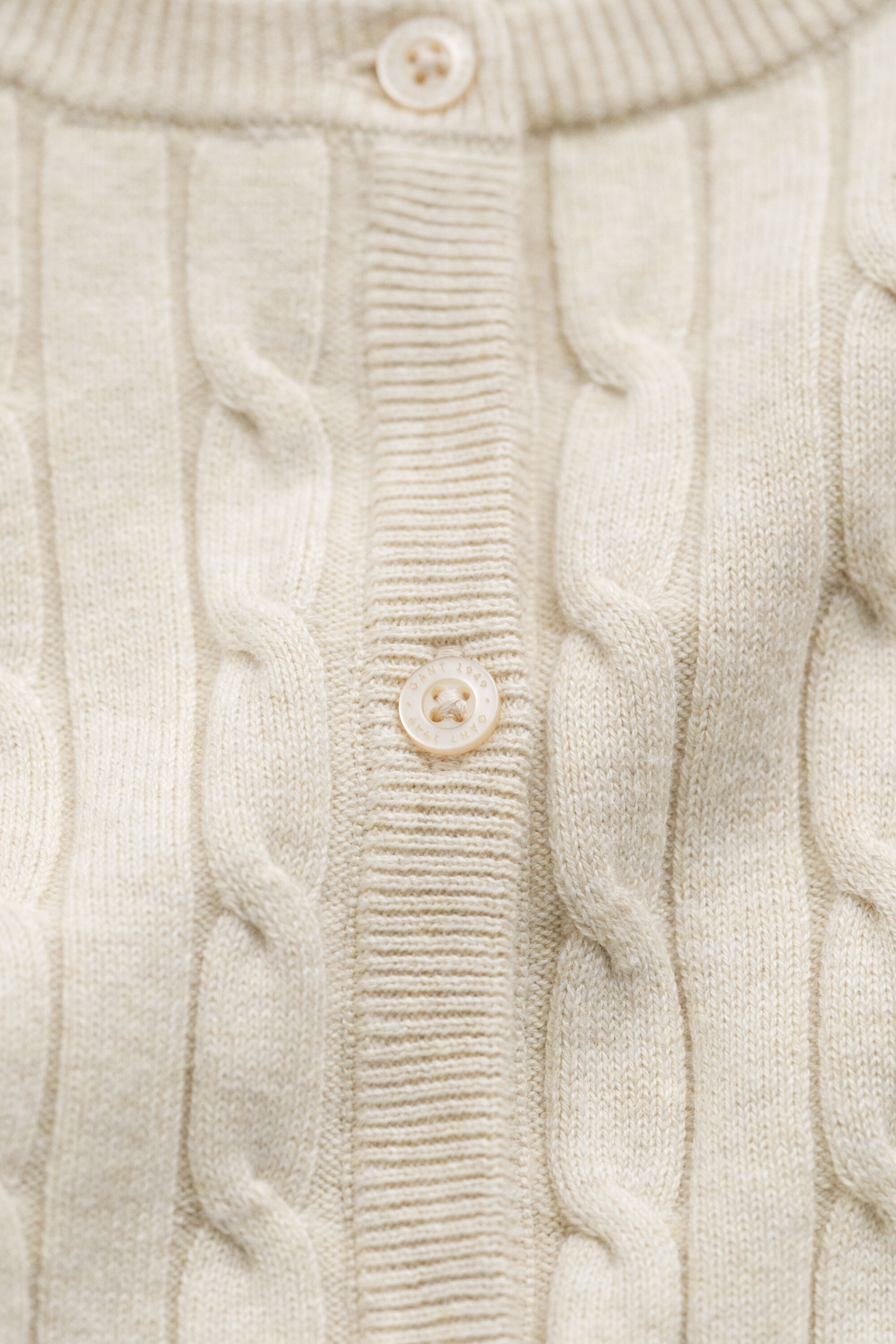 Cardigan in maglia di cotone elasticizzato a trecce