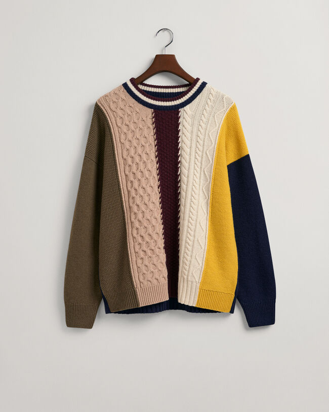 Patchwork Rundhalspullover mit Zopfmuster