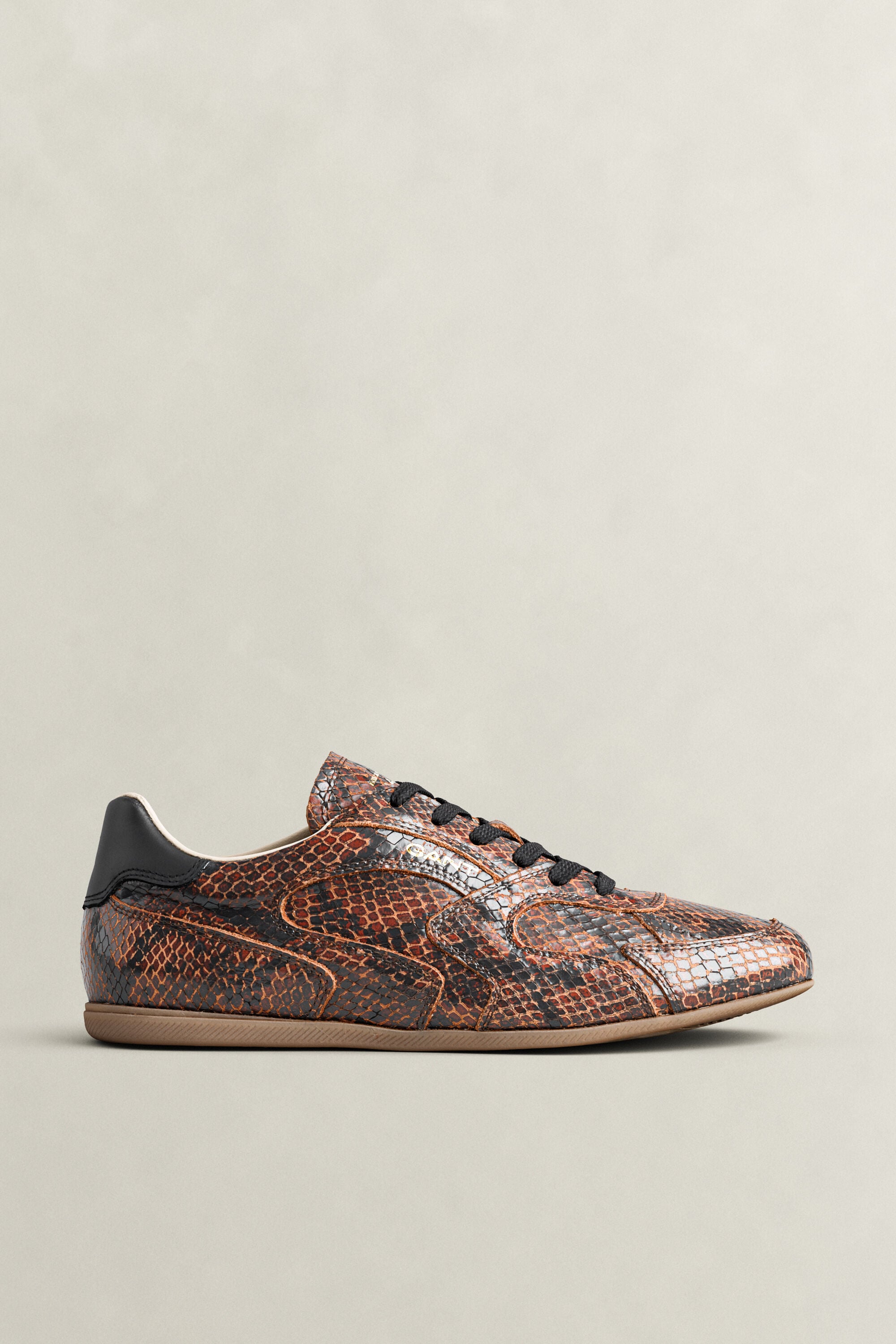 Sneakers Spelly in pelle con effetto serpente