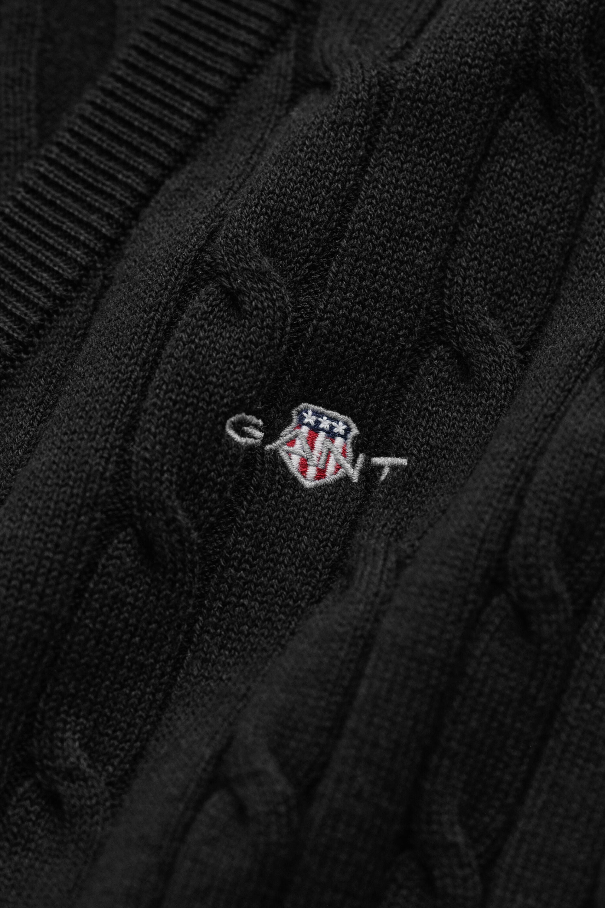 Maglia con scollo a V in cotone elasticizzato a trecce