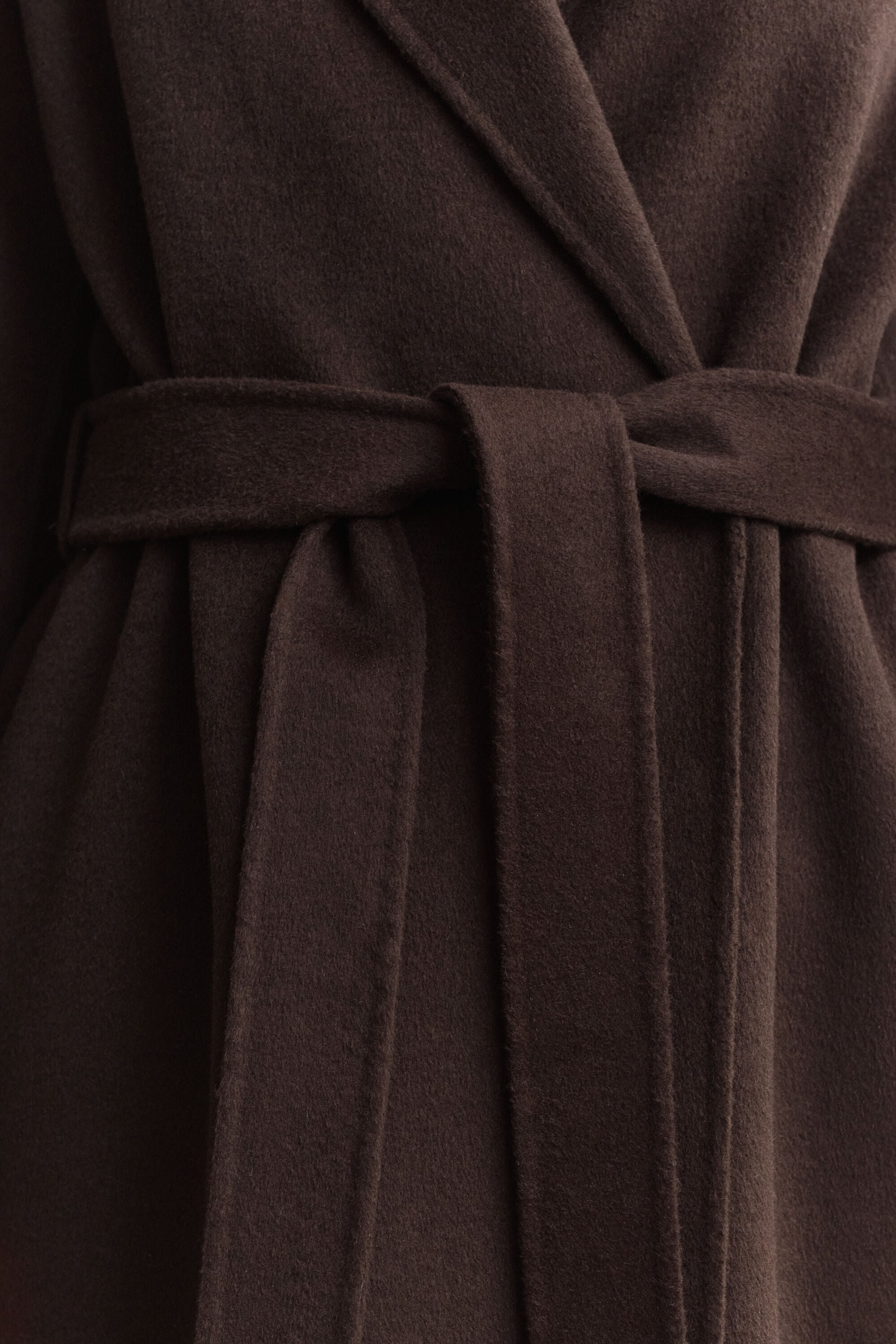 Manteau cousu main avec ceinture
