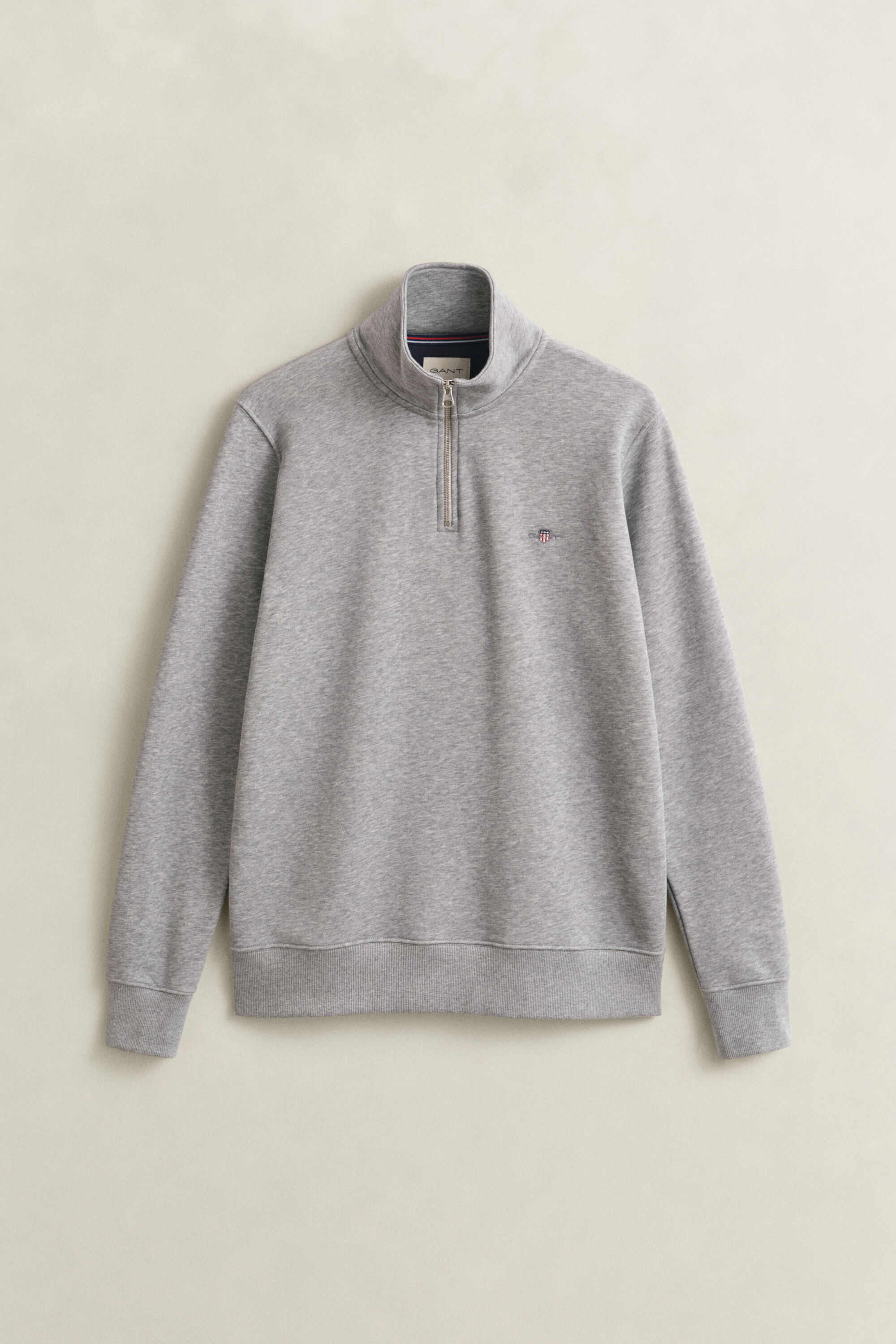 Felpa Shield con zip corta