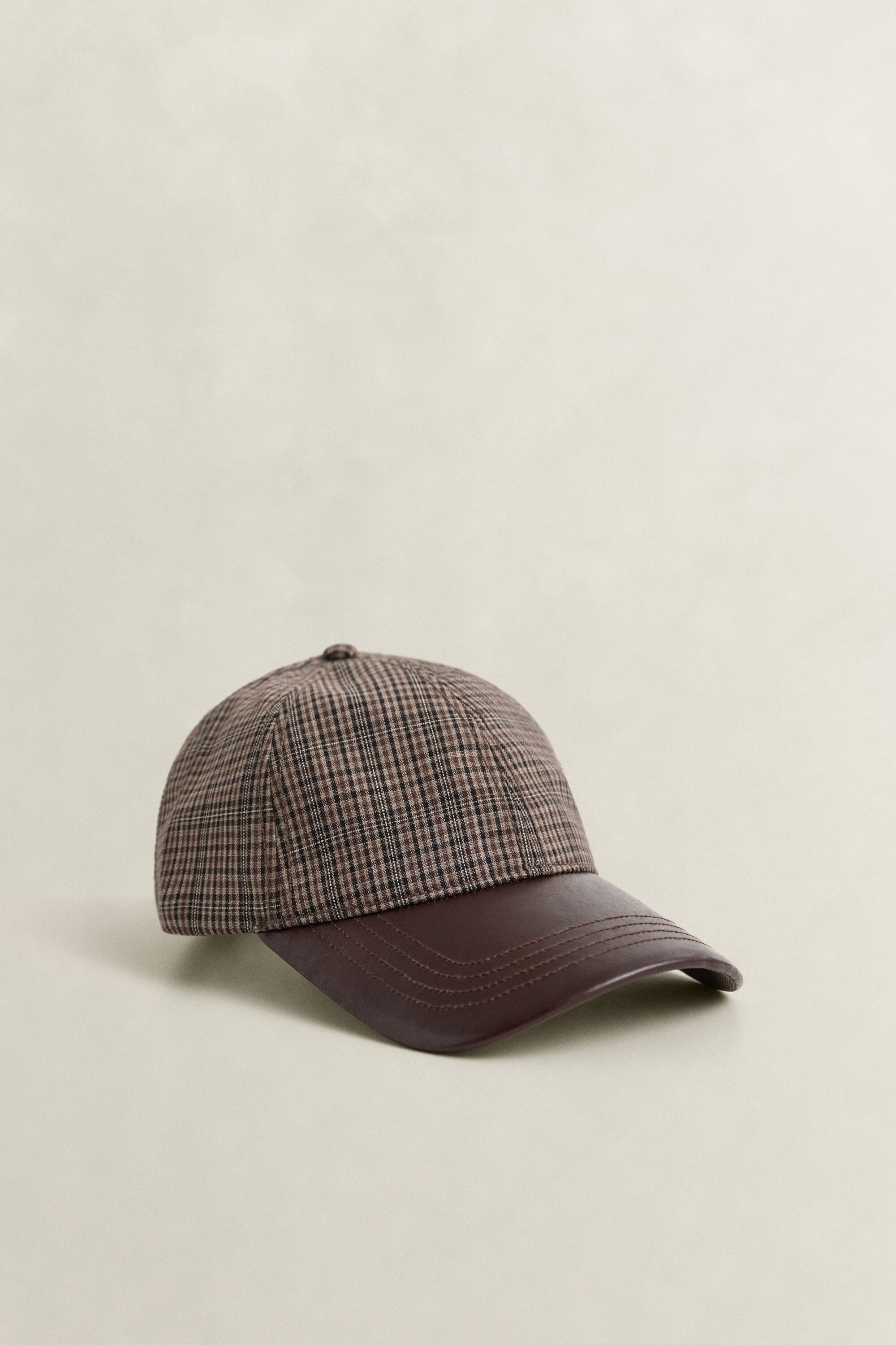 Kariertes Wollcap mit Lederschirm