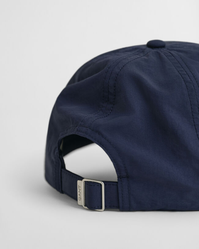 Cap in Crinkle-Optik mit kleiner Grafik